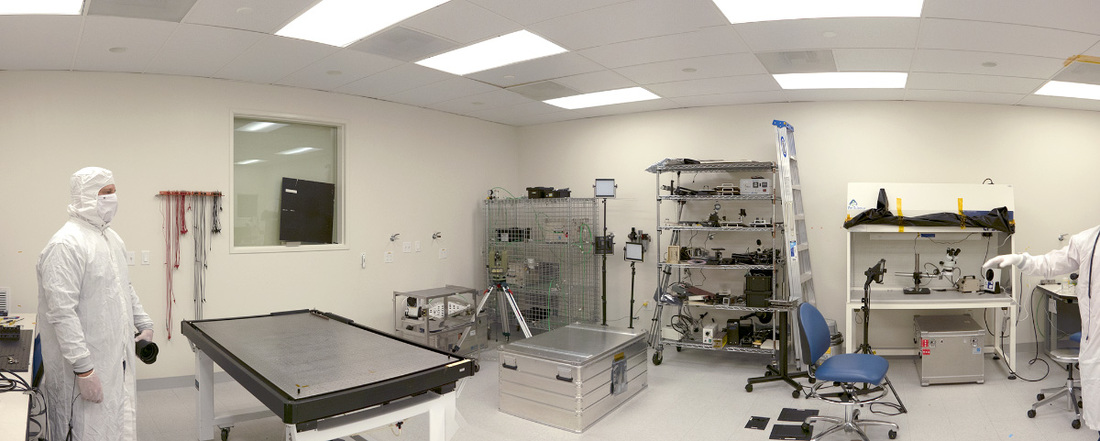 A photo from inside the MSSS clean room as the ShadowCam engineering team prepares to move the shipping container.