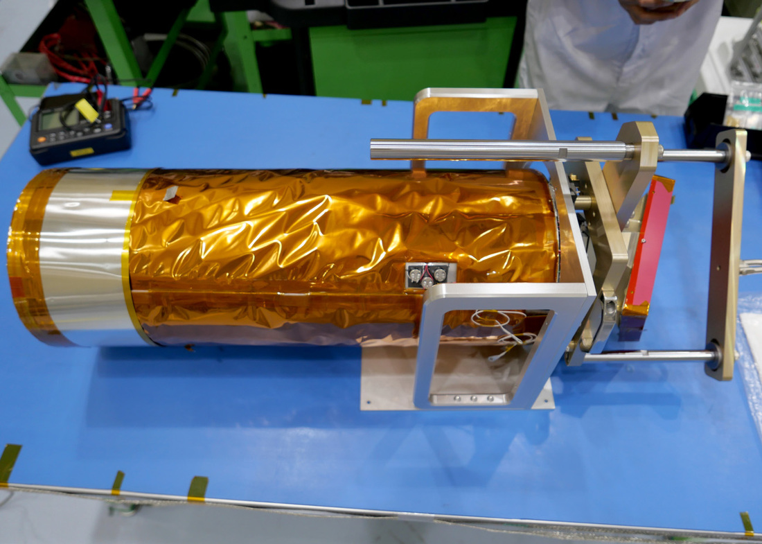 An image of ShadowCam with special supports installed in order to safely hoist it up and transfer it to its mounting spot on the KPLO satellite.