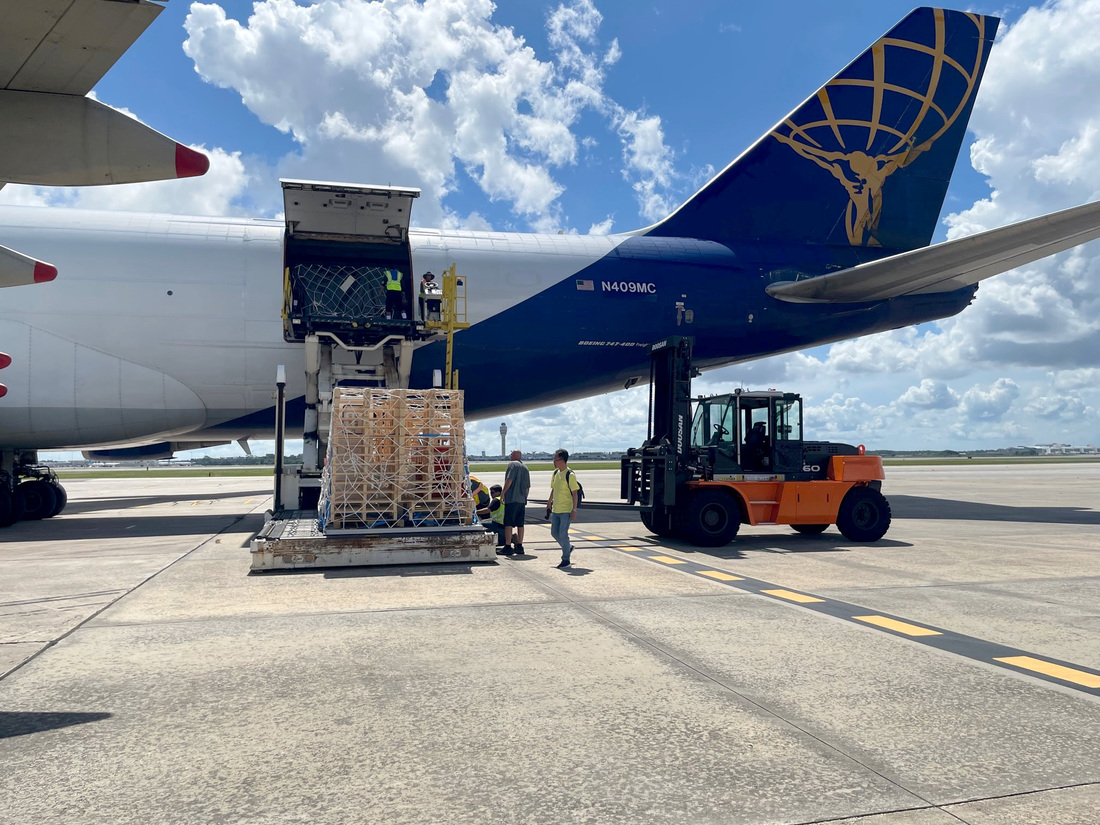 An image of the KPLO shipping container being carefully unloaded from the B-747 airliner at the Orlando International Airport on July 6.